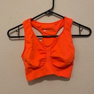 Neon orange sports bra
